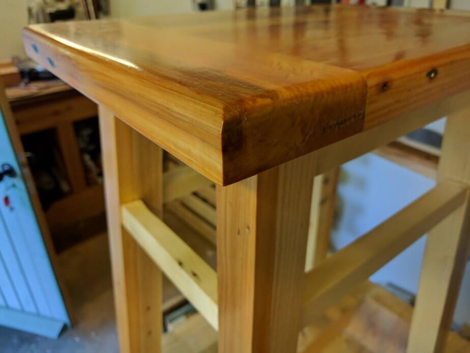 Breadboard end on the workbench stool woodcrafted