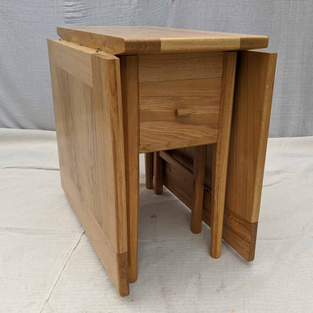The finished gateleg table with the dropleaves folded down