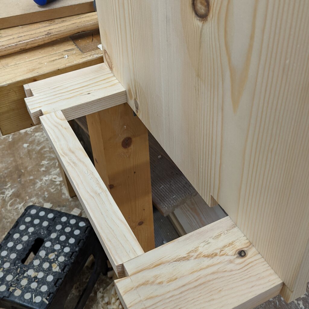 Sliding dovetails for the recessed vertical panel